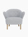 Front view of the Ingeborg Lounge Chair, featuring a light grey Fiord 751 textile upholstery and four natural oak legs.