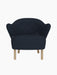 Front view of the Ingeborg Lounge Chair in dark navy Fiord 782, with a button-tufted backrest and natural oak legs.