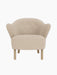 Front view of the Ingeborg Lounge Chair, light beige textured upholstery, button-tufted back and natural oak legs.