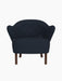 Front view of the Ingeborg Lounge Chair in dark blue Fiord 782 textile, featuring a tufted back and dark smoked oak legs.