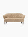 Front view of the Ingeborg Sofa in honey-coloured sheepskin, featuring a button-tufted back, curved arms, and dark oak legs.