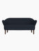 Front view of the Ingeborg Sofa in a dark navy blue textile, featuring a button-tufted back and smoked oak legs.