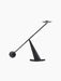 Interconnect Candle Holder, a sculptural piece with a geometric base and a long, balancing rod with a spherical weight.