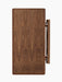 A front view of the foldable Jäger Lounge Table in walnut. The table is folded, highlighting the rich grain of the wood.