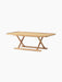 Angled Jäger Lounge Table in natural oak, with a rectangular top and foldable base with criss-cross X-shaped legs.
