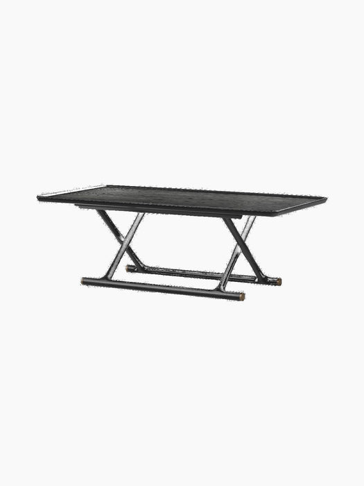 The Jäger Lounge Table in black stained oak shown at an angle, with a rectangular top and foldable X-frame base.