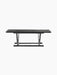 Front view of the Jäger Lounge Table in black stained oak, highlighting its foldable legs and brass details.