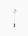 The JWDA Floor Lamp with a cylindrical white Carrara marble base, a bronzed brass stem, and an elliptical white glass shade.