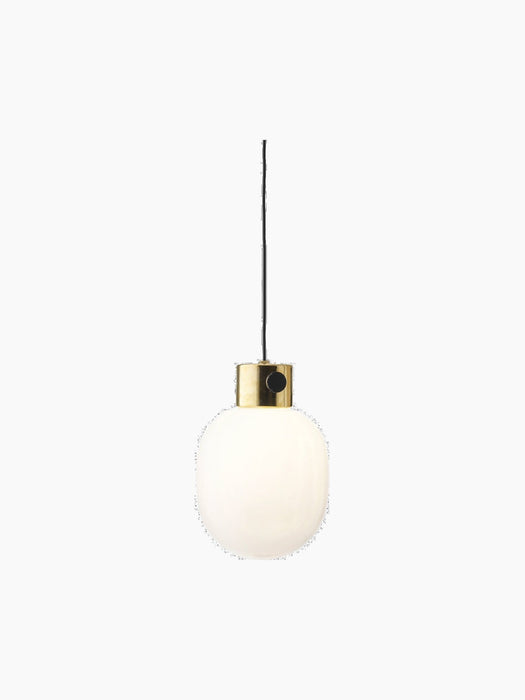 JWDA Metallic Pendant Lamp in polished brass with a white opal glass globe and a black dimmer switch on a black background
