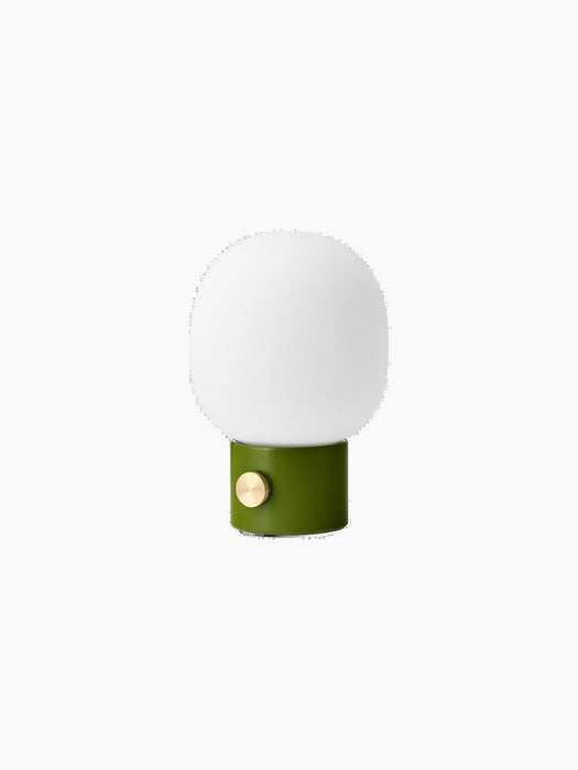 Angled view of the JWDA Table Lamp, Portable, with a dusty green base, brass dimmer switch and an opal glass shade.