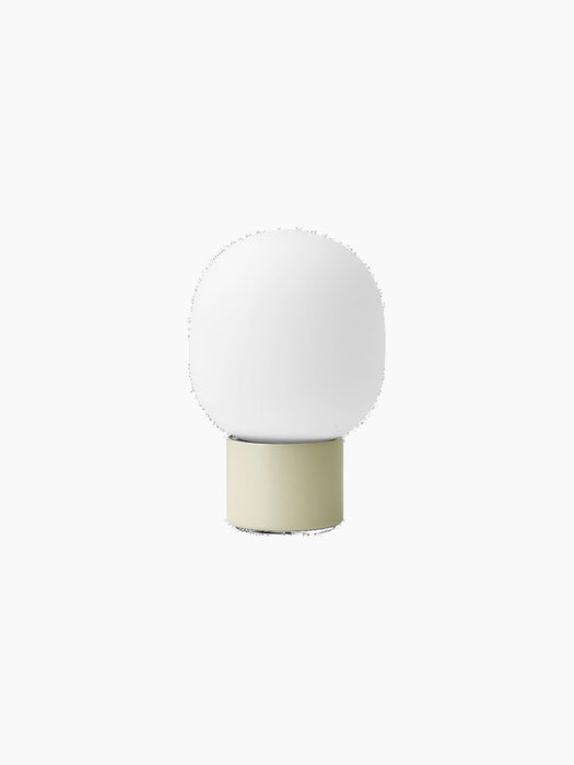 JWDA Portable Table Lamp in Alabaster White, seen from the back, with a cylindrical base and a frosted elliptical shade.