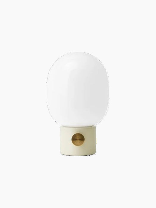 Front view of the JWDA Table Lamp, Small, with an Alabaster White steel base, brass dimmer and white opal glass shade.