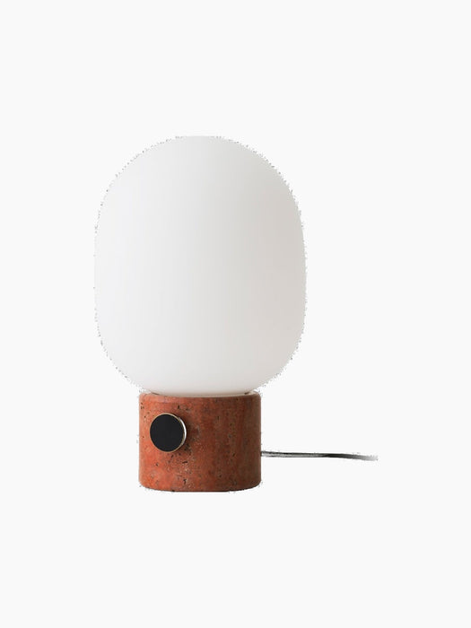 JWDA Table Lamp, Large with a porous, cylindrical Red Travertine Stone base and a large white glass shade.