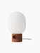 JWDA Table Lamp, Large with a porous, cylindrical Red Travertine Stone base and a large white glass shade.