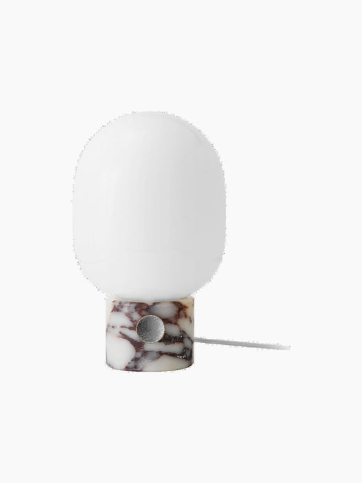 Front view of the turned-off JWDA Table Lamp, Large with a Calacatta Viola marble base, brass dimmer and opal glass shade.
