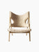 Front view of the Knitting Lounge Chair. The chair has a natural oak frame and off-white, textured sheepskin upholstery.