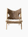 Front view of the Knitting Lounge Chair with a natural oak frame, upholstered in textured, light brown Sahara sheepskin.