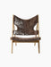 A front photo of the Knitting Lounge Chair. It features a Natural Oak frame and plush, dark brown Root Sheepskin upholstery.