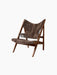 The Knitting Lounge Chair in Sheepskin Root, featuring a dark walnut wood A-frame and fluffy brown sheepskin upholstery.