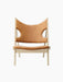 Front view of the Knitting Lounge Chair in Natural Oak, upholstered in Dunes Cognac leather with distinctive elbow cut-outs.
