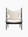 Front view of the Knitting Lounge Chair in Black Oak, featuring a textured ivory bouclé seat and backrest with side cut-outs.