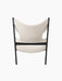 Rear view of the Knitting Lounge Chair in black oak with ivory bouclé upholstery, showing the distinctive cutouts.
