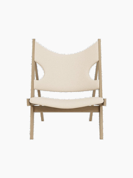 Front view of the Knitting Lounge Chair in natural oak with off-white textile upholstery on a black background.