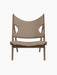 Front view of the Knitting Lounge Chair in walnut with light brown Logan Flint upholstery and its distinctive side cut-outs.