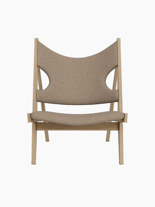 Front view of the Knitting Lounge Chair in Natural Oak. The chair has Logan Flint upholstery with distinctive elbow cut-outs.