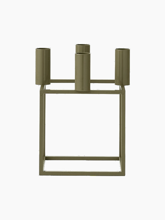 A front view of the Kubus 4 candle holder in a solid olive colour, featuring a square base and four cylindrical candle cups.