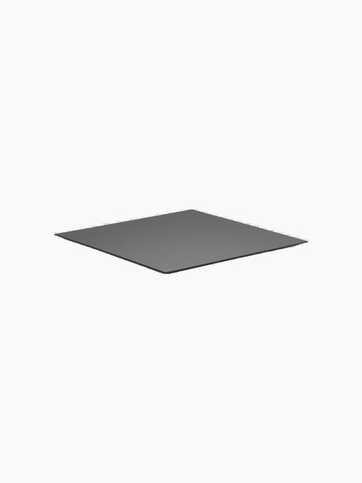 The Base for Kubus 8 in black, a thin square metal plate shown at an angle against a solid black background.