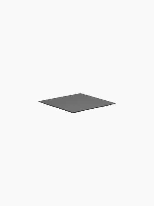 A close-up of the square, black Base for Line. The flat base is shown from an angle against a plain black background.