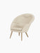 The Oda Lounge Chair, shown from a three-quarter angle, featuring light beige Hallingdal 200 upholstery and natural oak legs.