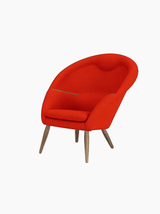 A three-quarter view of the Oda Lounge Chair, upholstered in a vibrant red Hallingdal 600 fabric with tapered walnut legs.