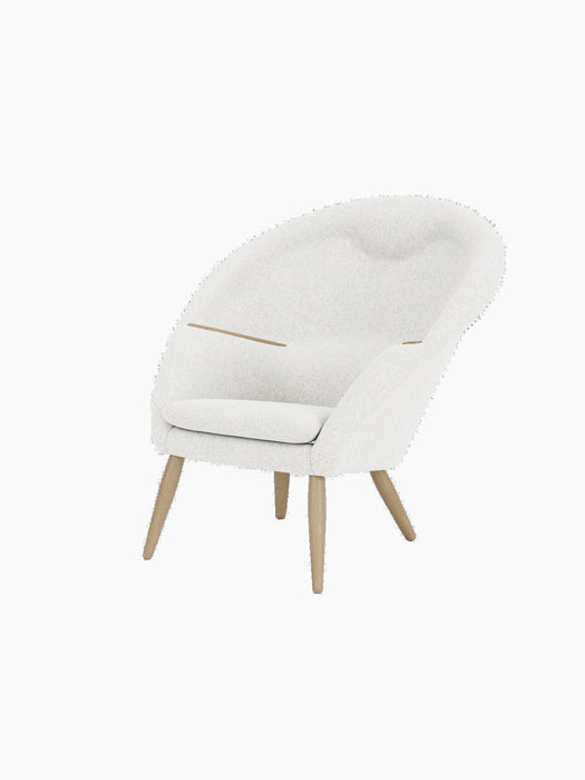 Three-quarter view of the Oda Lounge Chair in light grey Hallingdal 110 fabric with natural oak legs and armrests.