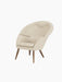 A three-quarter view of the Oda Lounge Chair, upholstered in light grey textured Hallingdal fabric with dark walnut legs.