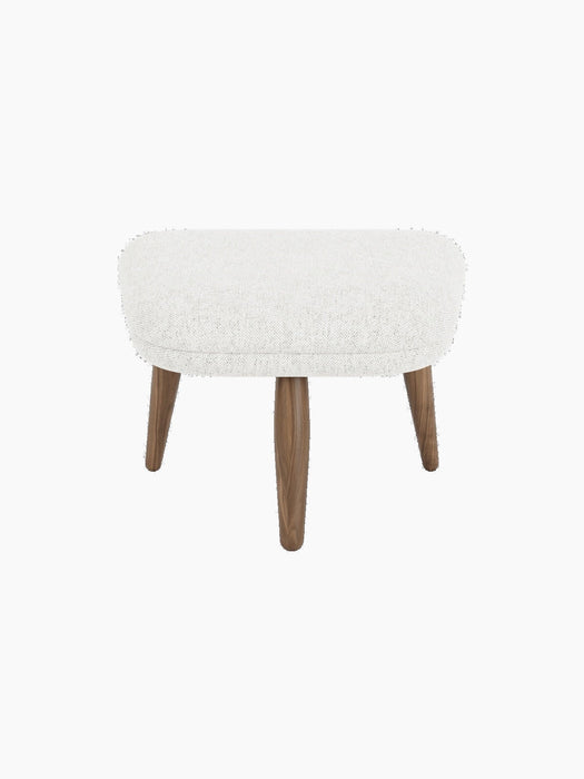 Front view of the Oda Ottoman. Cushioned seat in light grey Hallingdal 110 fabric and four tapered walnut legs.
