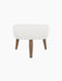 Front view of the Oda Ottoman. Cushioned seat in light grey Hallingdal 110 fabric and four tapered walnut legs.