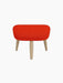 Front view of the Oda Ottoman upholstered in bright red Hallingdal 600 fabric with four natural oak legs.