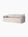 A light-coloured three-seater Offset Sofa w. Loose Cover with two large back cushions and two smaller pillows at the arms.