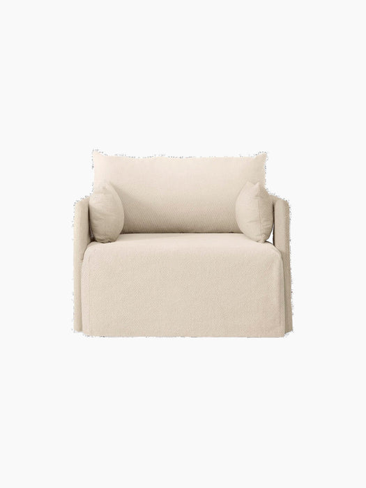 Front view of the one-seater Offset Sofa. It has a relaxed silhouette with a textured, light beige Logan Jasmine loose cover.