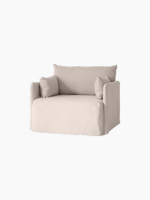 Angled view of the one-seater Offset Sofa with Loose Cover in a light grey fabric, shown against a solid black background.