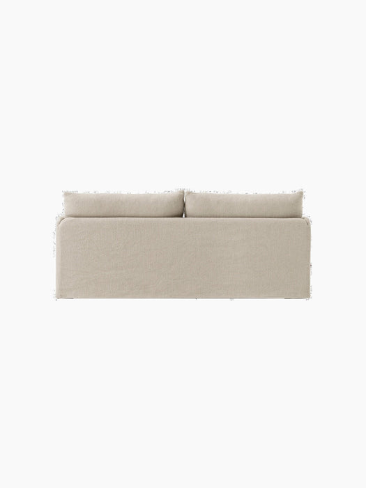 Rear view of the Offset Sofa w. Loose Cover, a 2-seater model in a textured, sand-coloured fabric on a black background.