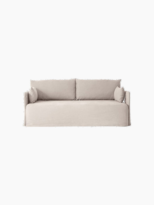 Front view of the light grey Offset Sofa w/ Loose Cover. It has two large back cushions and two small side cushions.