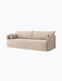 Angled view of the Audo Offset Sofa with Loose Cover. The 3-seater sofa is upholstered in a textured sand-coloured fabric.