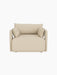A front, high-angle view of the Offset Sofa, a one-seater armchair upholstered in textured, sand-coloured Logan fabric.