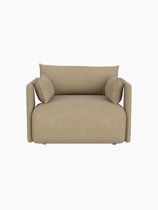 Front view of the Offset Sofa, a 1-seater armchair upholstered in light beige Audo Bouclé 02 fabric on black background