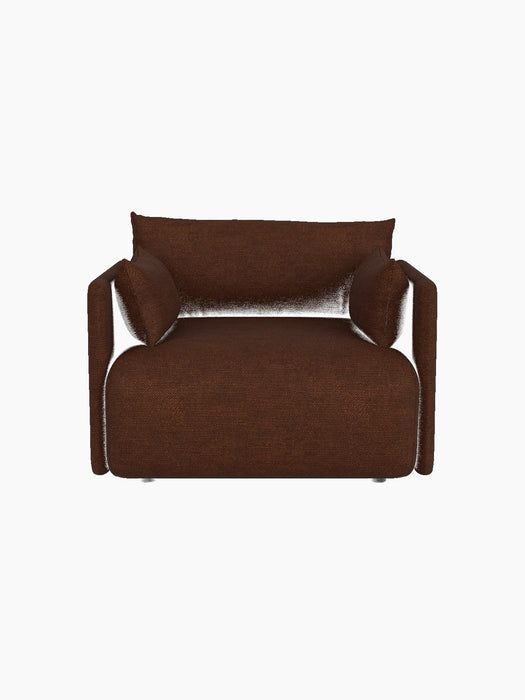 A front view of the Offset Sofa, a one-seater armchair in textured brown Audo Bouclé 08 fabric on a black background.