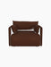 A front view of the Offset Sofa, a one-seater armchair in textured brown Audo Bouclé 08 fabric on a black background.