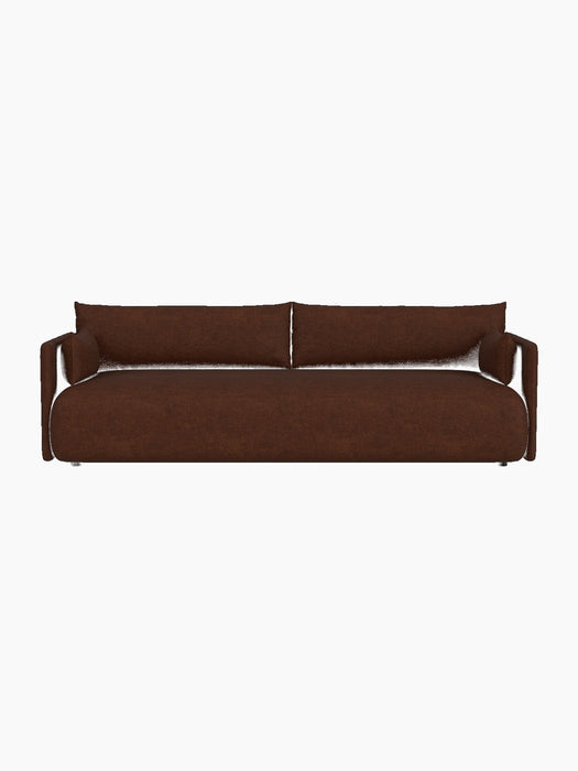 Front-on view of the Offset Sofa, a three-seater upholstered in warm brown bouclé fabric, against a black background.